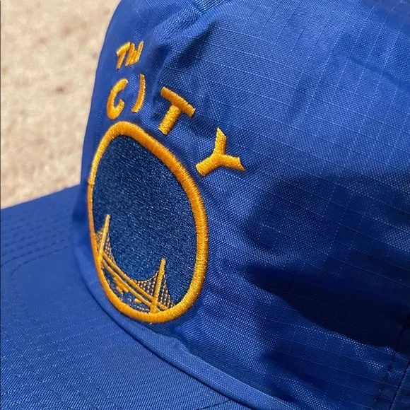 MITCHELL & NESS WARRIORS “THE CITY” WATERPROOF ZIPBACK